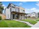 Modern home with a covered porch and landscaped front yard at 2391 King St, Denver, CO 80211