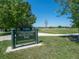 Sloan's Lake Park sign surrounded by lush greenery and open spaces on a sunny day at 2391 King St, Denver, CO 80211
