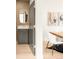 Stylish powder room with modern vanity, unique mirror, and elegant design, located next to dining room at 2391 King St, Denver, CO 80211