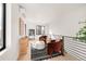 Bright upstairs landing with stylish decor, and black metal railings creates a tranquil atmosphere at 2391 King St, Denver, CO 80211