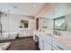 Modern bathroom featuring dual vanities, a soaking tub, walk-in shower, and sleek design at 8469 Winter Berry Dr, Castle Pines, CO 80108