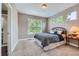 Bedroom with a bed, window, carpet, and side table at 8469 Winter Berry Dr, Castle Pines, CO 80108