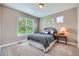 Bedroom with a bed, window, carpet, and side table at 8469 Winter Berry Dr, Castle Pines, CO 80108