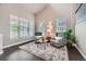 Bright living room featuring vaulted ceilings, two armchairs, a shag rug and large windows at 8469 Winter Berry Dr, Castle Pines, CO 80108