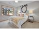 Cozy bedroom with large window providing outdoor view at 1374 Crested Butte Ct, Evergreen, CO 80439