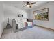 Bright bedroom with carpet, a large window, and comfortable furnishings at 1374 Crested Butte Ct, Evergreen, CO 80439
