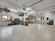Spacious and organized garage with ample storage space, epoxy floors, and well-lit interiors at 1374 Crested Butte Ct, Evergreen, CO 80439