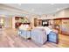 Open living area with wet bar, fireplace, and ample room for entertaining at 1374 Crested Butte Ct, Evergreen, CO 80439