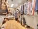 Large walk-in closet with ample storage and hardwood floors at 1374 Crested Butte Ct, Evergreen, CO 80439