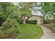 Serene backyard with lush greenery, mature trees, and a charming shed, creating a private outdoor space at 2203 S Lincoln St, Denver, CO 80210