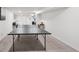 Spacious finished basement featuring a ping pong table and neutral carpeting at 2203 S Lincoln St, Denver, CO 80210