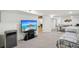 Finished basement with a minibar, a television, a daybed and neutral carpeting at 2203 S Lincoln St, Denver, CO 80210