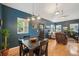 Bright dining area with natural light, wood floors, and ample space for Gathering gatherings and entertainment at 2203 S Lincoln St, Denver, CO 80210