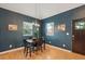 Bright dining area with hardwood floors, natural light, and seating for four in a comfortable, stylish setting at 2203 S Lincoln St, Denver, CO 80210