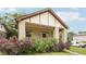 Well maintained brick home with covered front porch and lush landscaping, creating a warm curb appeal at 2203 S Lincoln St, Denver, CO 80210