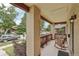 Inviting front porch with brick columns and railing, perfect for relaxing with outdoor furniture at 2203 S Lincoln St, Denver, CO 80210