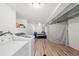 Laundry area in the finished basement with a new washer and dryer, plus plenty of room for sorting at 2203 S Lincoln St, Denver, CO 80210