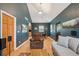 Inviting living room with hardwood floors, open archway, and a bright and airy atmosphere for relaxation at 2203 S Lincoln St, Denver, CO 80210