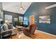 Inviting living room with vaulted ceilings, fan, wood floors, and tasteful decor for cozy relaxation at 2203 S Lincoln St, Denver, CO 80210