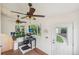 Sunroom with lots of natural light, multiple ceiling fans, and an exterior door at 2203 S Lincoln St, Denver, CO 80210