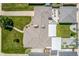 Aerial view of a well-maintained home showcasing its roof, manicured landscaping, and outdoor patio at 2845 Hudson St, Denver, CO 80207