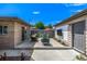 Backyard patio area features modern seating area and an outdoor fire pit at 2845 Hudson St, Denver, CO 80207