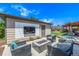 Inviting outdoor patio with modern fire pit and seating area at 2845 Hudson St, Denver, CO 80207