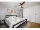 Bright bedroom with hardwood floors, a ceiling fan, and ample closet space at 2845 Hudson St, Denver, CO 80207