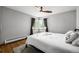Calm bedroom with a neutral color palette and a ceiling fan at 2845 Hudson St, Denver, CO 80207