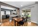 Stylish dining room with an adjacent kitchen and a sliding door to the backyard at 2845 Hudson St, Denver, CO 80207