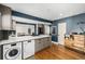 Open kitchen featuring stainless appliances, white countertops, and an island at 2845 Hudson St, Denver, CO 80207