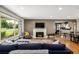 Comfortable living room featuring a fireplace and a large window at 2845 Hudson St, Denver, CO 80207