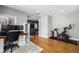 Spacious multi-use room; office and workout area, featuring hardwood floors and neutral walls at 2845 Hudson St, Denver, CO 80207