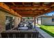 Covered patio featuring comfortable outdoor seating with backyard views at 2845 Hudson St, Denver, CO 80207