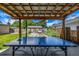 Covered patio space with ping pong table and view of the backyard at 2845 Hudson St, Denver, CO 80207