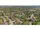 Beautiful aerial view of a neighborhood, showcasing lush greenery and community tennis courts at 6083 S Glencoe Way, Centennial, CO 80121