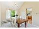 Inviting dining room with a wooden table and ample natural light at 6083 S Glencoe Way, Centennial, CO 80121
