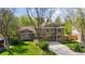 Aerial view of a home showcasing its well-manicured lawn, mature trees, and inviting curb appeal at 6083 S Glencoe Way, Centennial, CO 80121