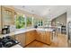 Bright and airy kitchen featuring modern appliances, countertops, and ample cabinet space at 6083 S Glencoe Way, Centennial, CO 80121