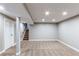 This finished basement includes carpet, recessed lights, and stairway access at 7163 S Xanthia St, Centennial, CO 80112