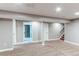 Spacious finished basement offering ample room with adjacent bathroom and staircase at 7163 S Xanthia St, Centennial, CO 80112