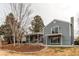 Exterior of a two-story home featuring a backyard, patio, and covered balcony at 7163 S Xanthia St, Centennial, CO 80112