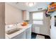 Functional laundry room with modern washer and dryer, storage, and practical design at 7163 S Xanthia St, Centennial, CO 80112