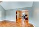 Home office featuring hardwood floors, a modern light fixture, and ample natural light at 7163 S Xanthia St, Centennial, CO 80112