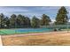 Community tennis court with a well-maintained court surface and a secure chain-link fence at 7163 S Xanthia St, Centennial, CO 80112