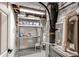 Utility room containing water heater, furnace, and shelving at 7163 S Xanthia St, Centennial, CO 80112