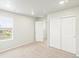 Well-lit bedroom with window, closet, and neutral decor at 8905 Rifle St, Commerce City, CO 80022