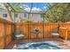Back yard patio shaded by metal pergola, wood fence, and mature trees at 8843 W Phillips Dr, Littleton, CO 80128