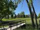 The community features a expansive green space with mature trees and a charming wooden bridge for pedestrians at 8843 W Phillips Dr, Littleton, CO 80128