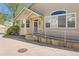Close up exterior of home with ramp and well-maintained landscaping at 8843 W Phillips Dr, Littleton, CO 80128